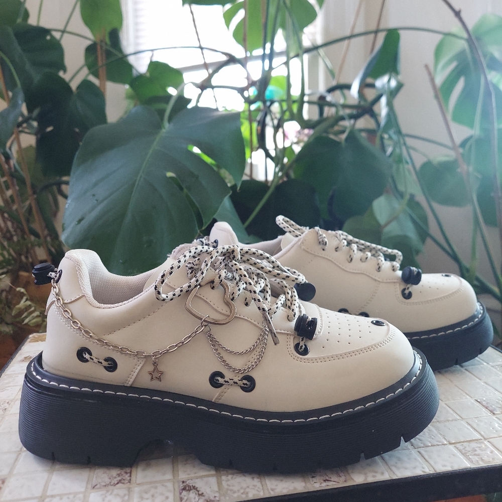 platform cream loafers with chain details